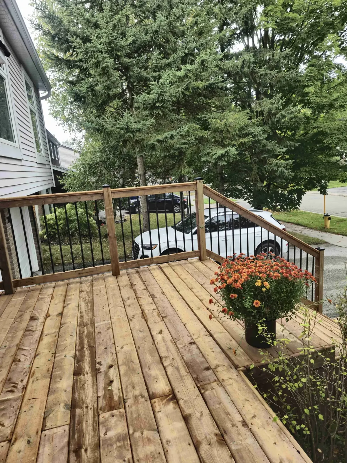 Install front porch cedar wood deck with railing for enhanced curb appeal and safe entry