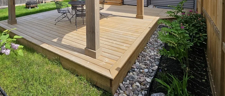 Low cedar deck pad built as the floor under a gazebo, lifting it clear of wet ground