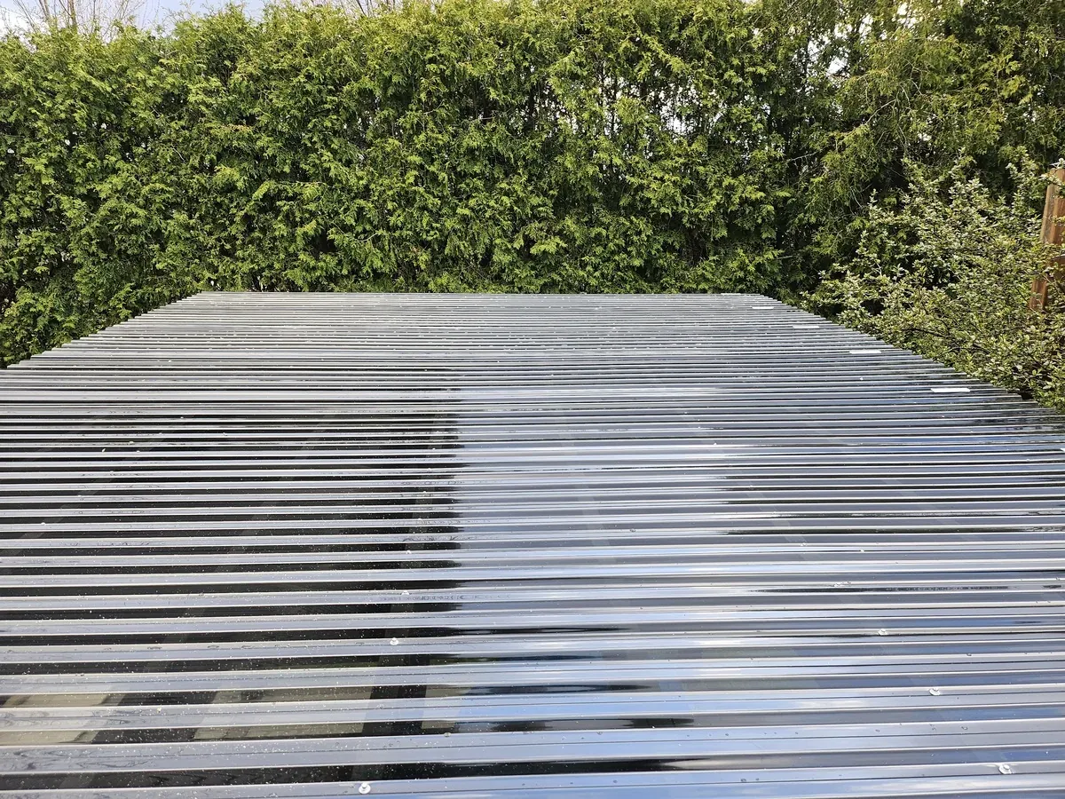 Evenly spaced cedar slats forming an open pergola shade roof over a patio in Newmarket, Ontario