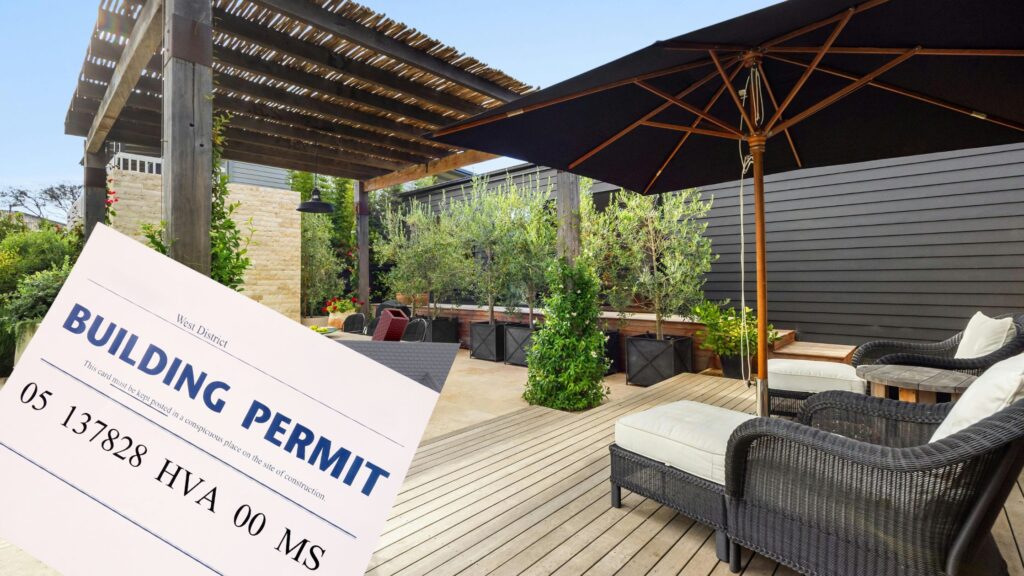 Outdoor backyard deck with pergola, lounge chairs, and building permit card, representing deck permits in Newmarket for safe and legal construction.