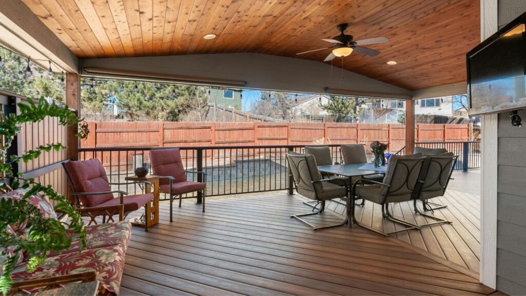 “Covered outdoor deck with seating area showcasing PVC decking in Ontario, helping homeowners answer the question: Is PVC Decking Worth It?